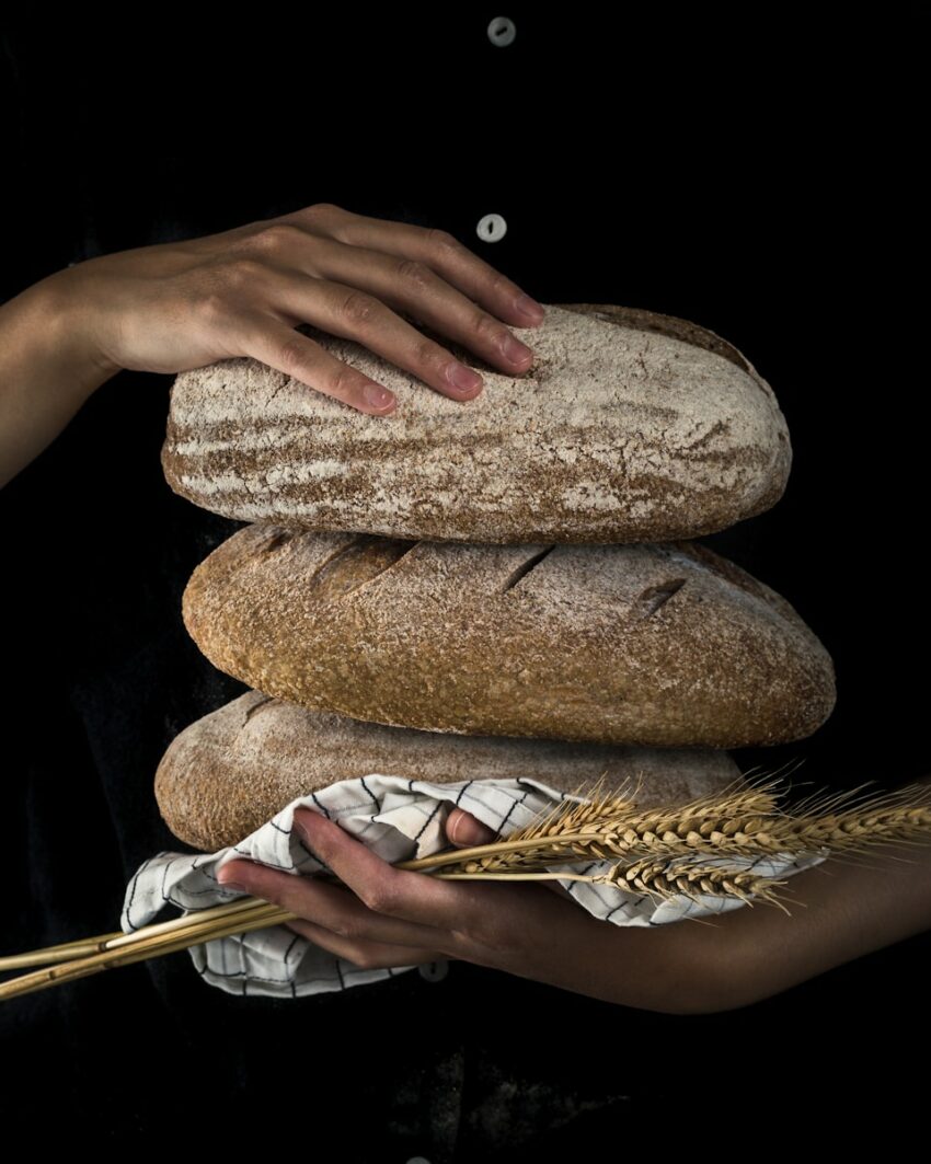 person holding baked bread